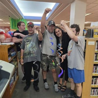 Greenelight members and staff sharing their craft in the library 